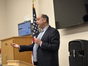 Sen Jamie Eldridge speaks at a podium